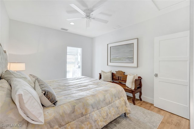 bedroom with ceiling fan and light wood-type flooring