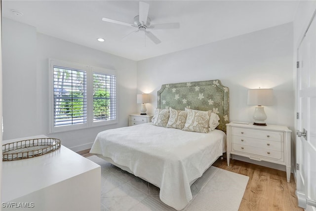 bedroom with light wood-type flooring and ceiling fan