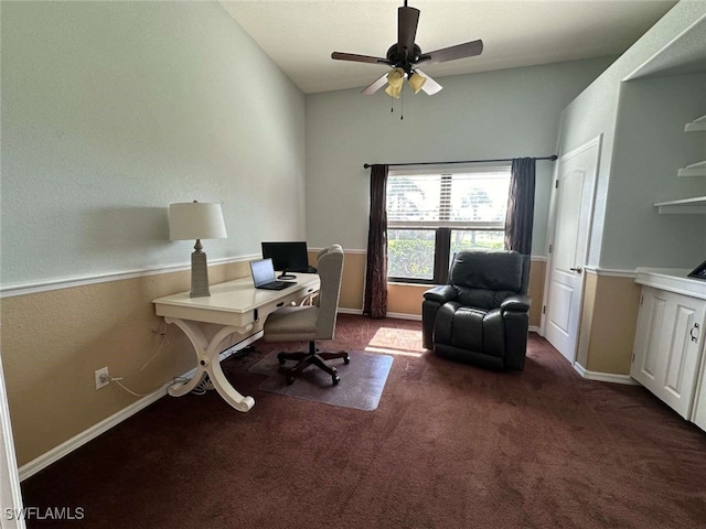 carpeted office space featuring ceiling fan and lofted ceiling