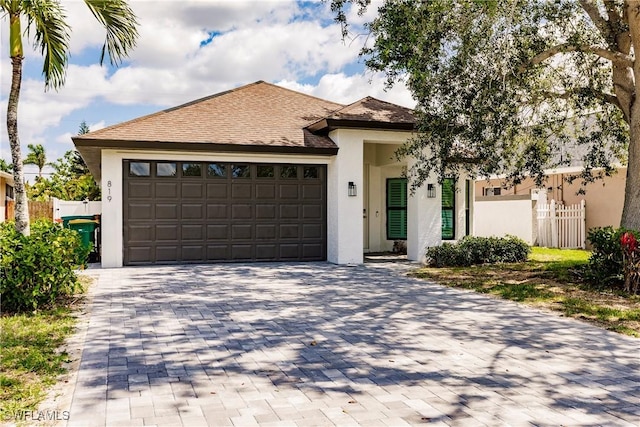 view of front of property with a garage