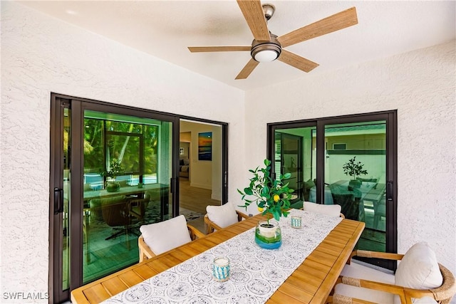 dining area featuring ceiling fan and wood-type flooring