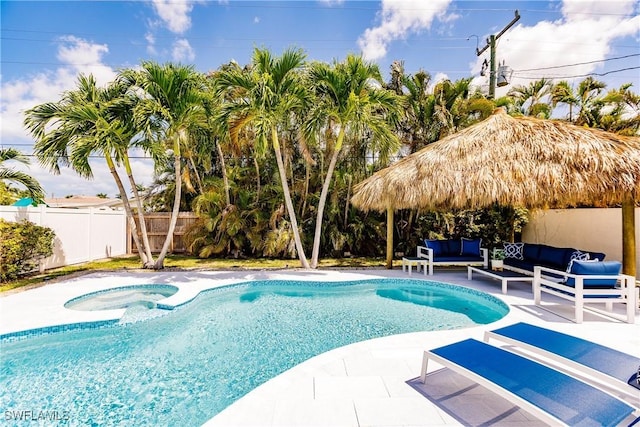 view of swimming pool with an outdoor living space and a patio area