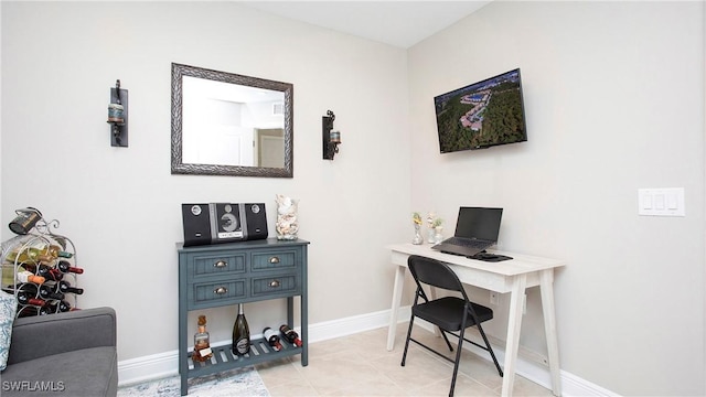 office with light tile patterned floors and baseboards