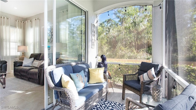 sunroom / solarium featuring plenty of natural light