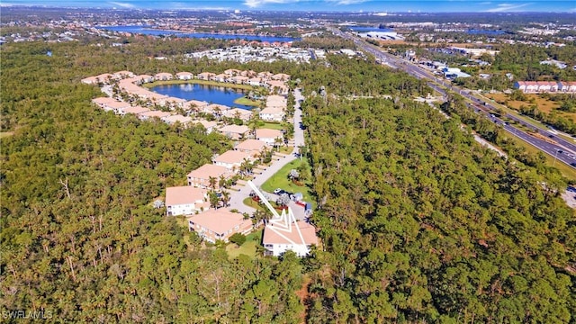 bird's eye view with a water view and a residential view