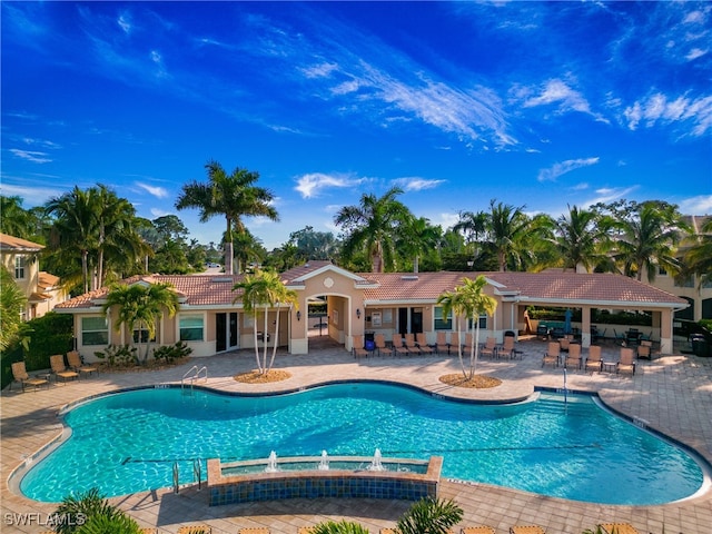 view of pool featuring a patio