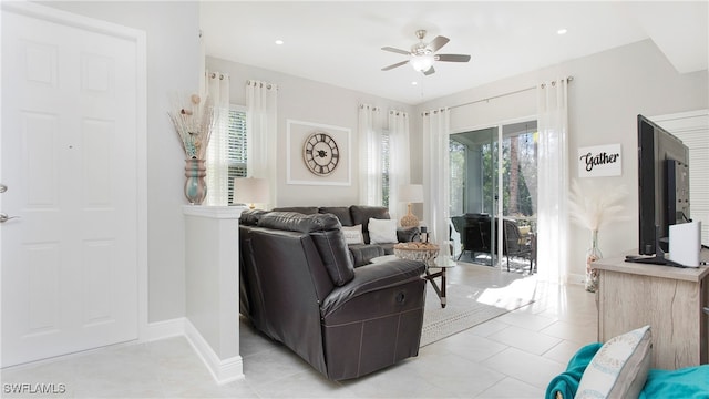 living room featuring ceiling fan and light tile patterned flooring