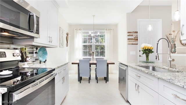 kitchen featuring white cabinets and appliances with stainless steel finishes