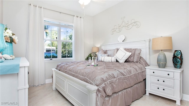 bedroom featuring ceiling fan and light tile patterned flooring