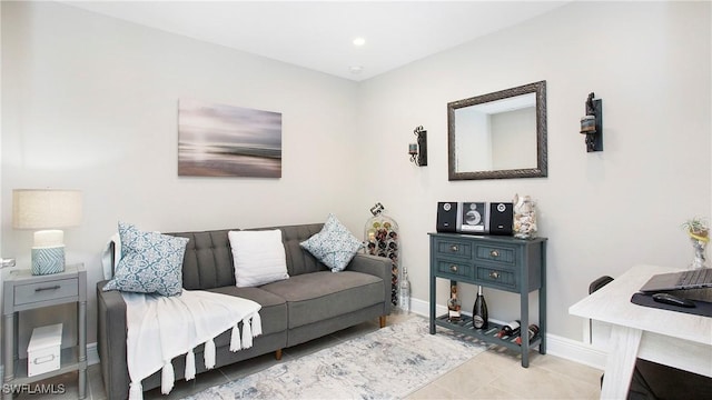 tiled living area featuring baseboards