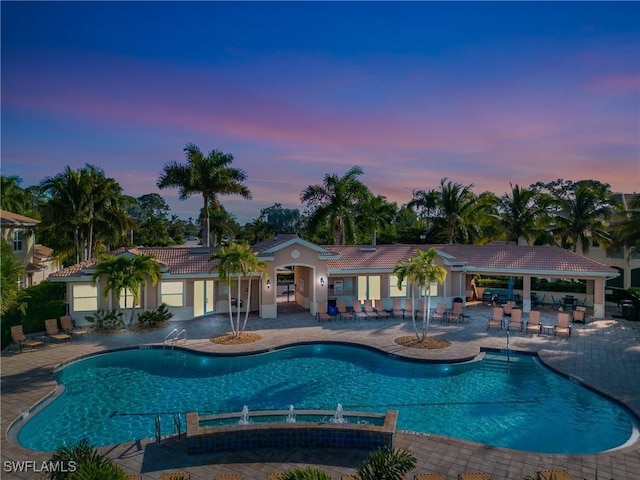 pool featuring a patio area and fence