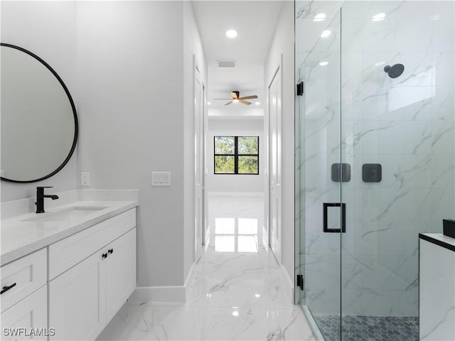 bathroom featuring ceiling fan, vanity, and an enclosed shower