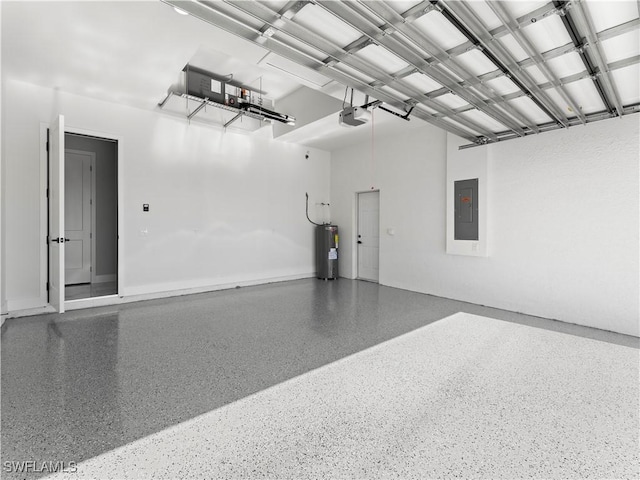 garage featuring electric panel, electric water heater, and a garage door opener