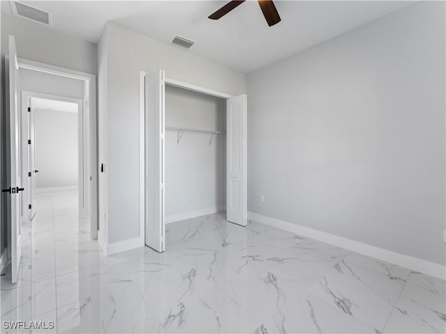 unfurnished bedroom featuring ceiling fan and a closet