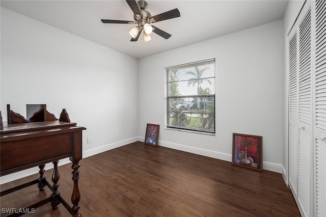 office space with ceiling fan and dark hardwood / wood-style floors