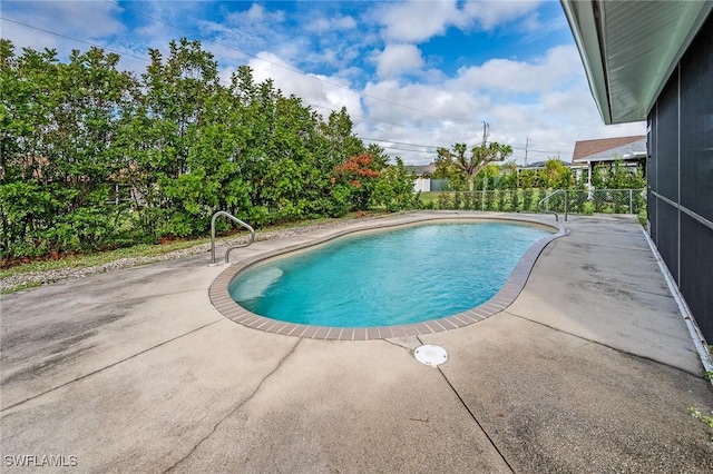 view of swimming pool featuring a patio area