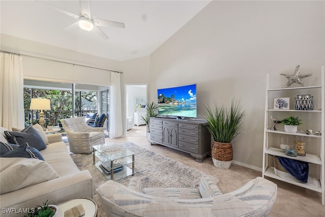 living room with light tile patterned floors, high vaulted ceiling, and ceiling fan