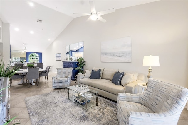 tiled living room featuring high vaulted ceiling and ceiling fan