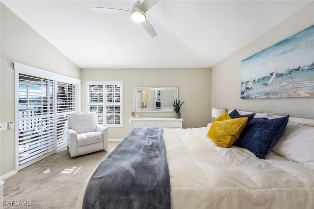 carpeted bedroom with ceiling fan and lofted ceiling