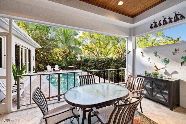 balcony with a patio area and outdoor dining space