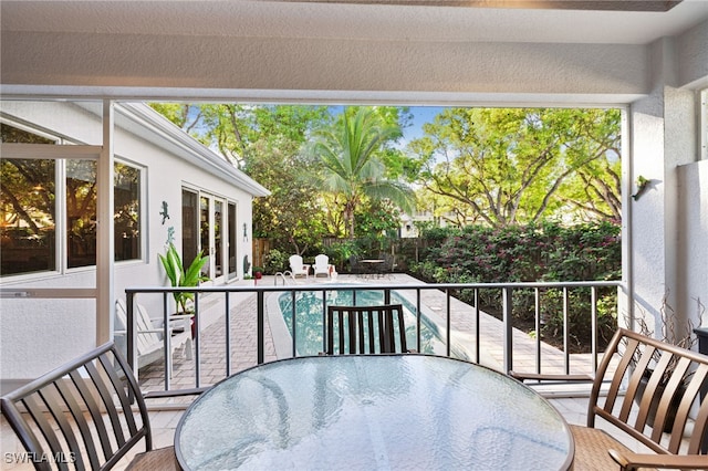 balcony featuring a patio and outdoor dining space