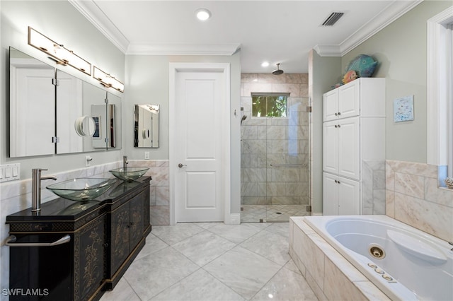 full bath featuring a sink, a jetted tub, visible vents, and crown molding