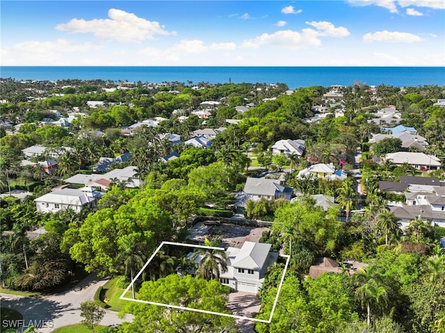 bird's eye view featuring a water view and a residential view