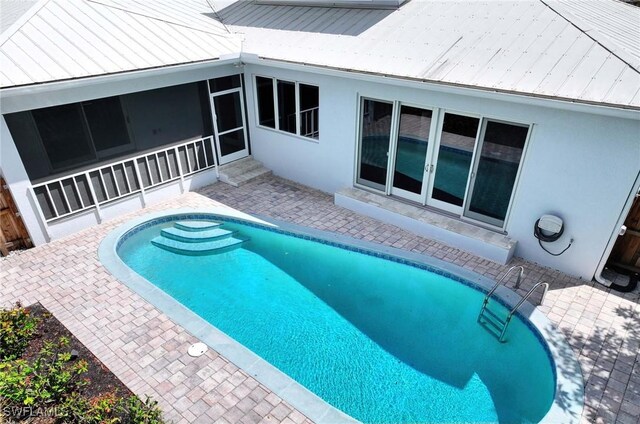 pool featuring a patio area