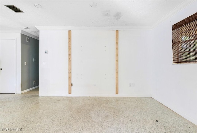 empty room featuring ornamental molding