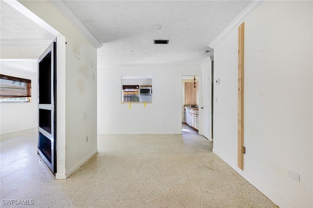 hallway featuring a textured ceiling and ornamental molding