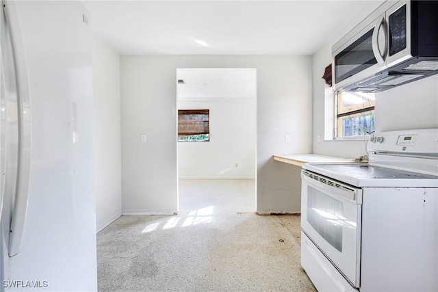 kitchen featuring white electric stove