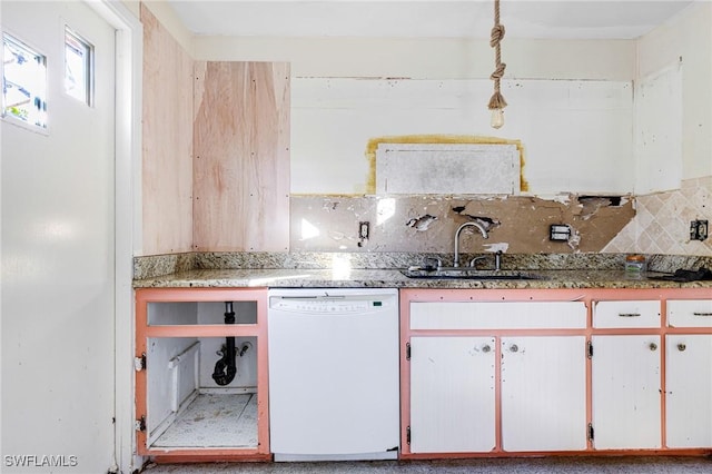 kitchen with white dishwasher, white cabinetry, sink, and tasteful backsplash