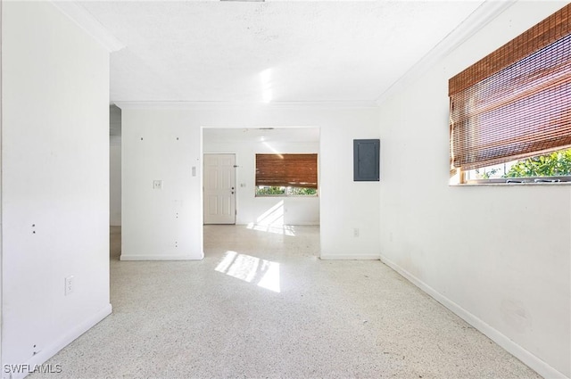 spare room with electric panel and ornamental molding