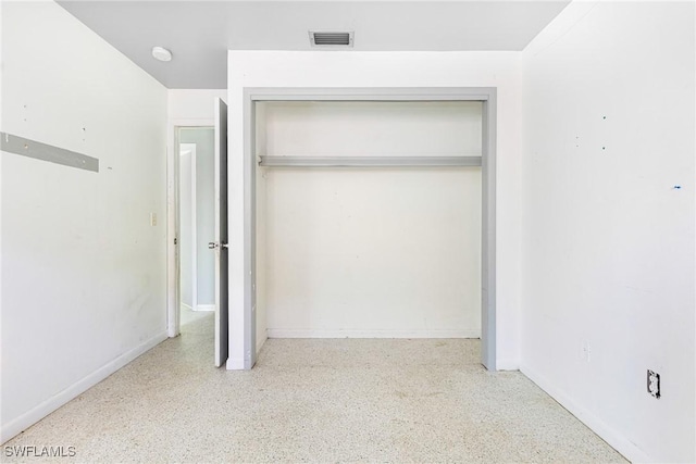 unfurnished bedroom featuring a closet