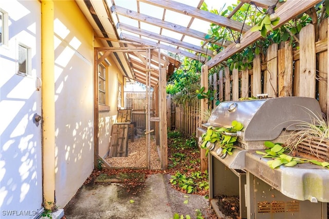 view of patio / terrace featuring a pergola and area for grilling