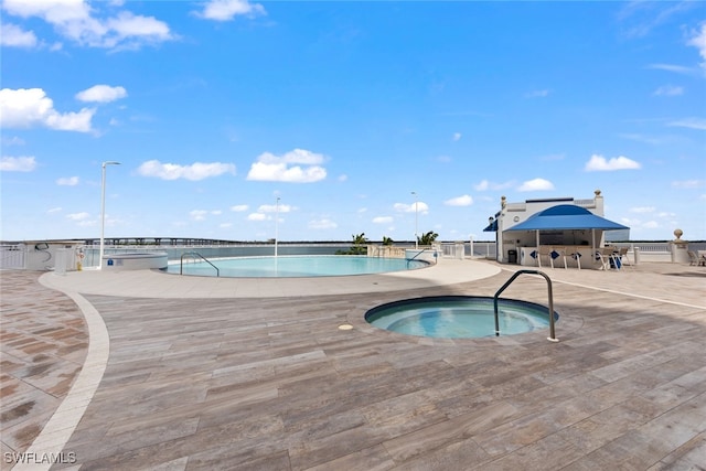 view of pool with a community hot tub