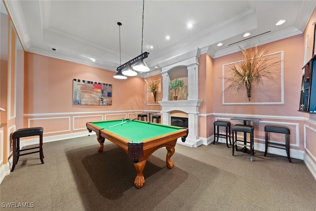 recreation room with carpet flooring, crown molding, and a tray ceiling