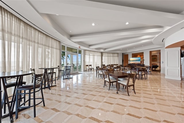 dining room featuring beamed ceiling