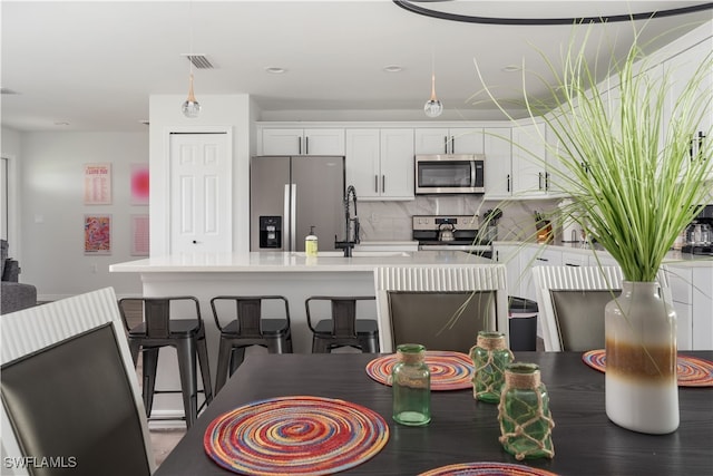 dining space featuring sink