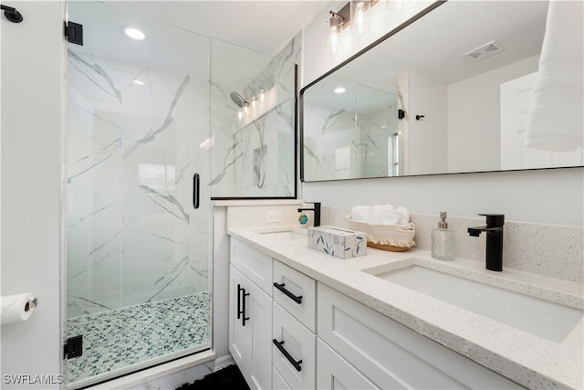 bathroom with vanity and an enclosed shower