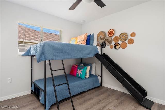 bedroom with hardwood / wood-style flooring and ceiling fan