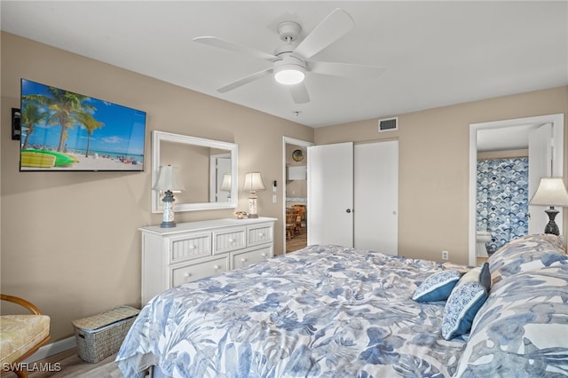 bedroom featuring connected bathroom, ceiling fan, and a closet