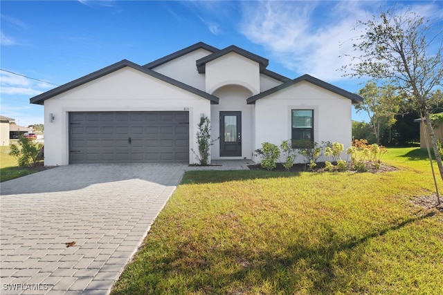 view of front of house with a front yard and a garage