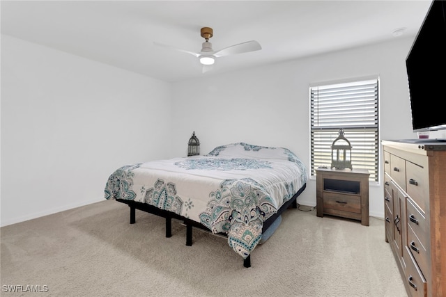 bedroom featuring ceiling fan and light carpet