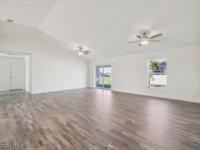 unfurnished living room with ceiling fan, plenty of natural light, vaulted ceiling, and hardwood / wood-style flooring