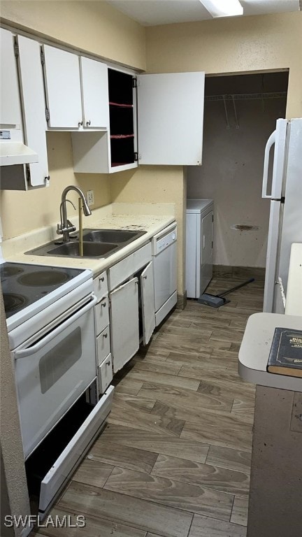 kitchen with white cabinetry, sink, ventilation hood, wood-type flooring, and white appliances