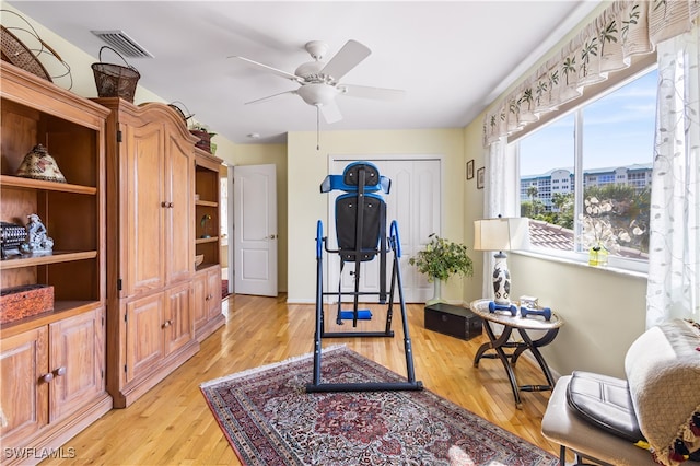 interior space with ceiling fan and light wood-type flooring