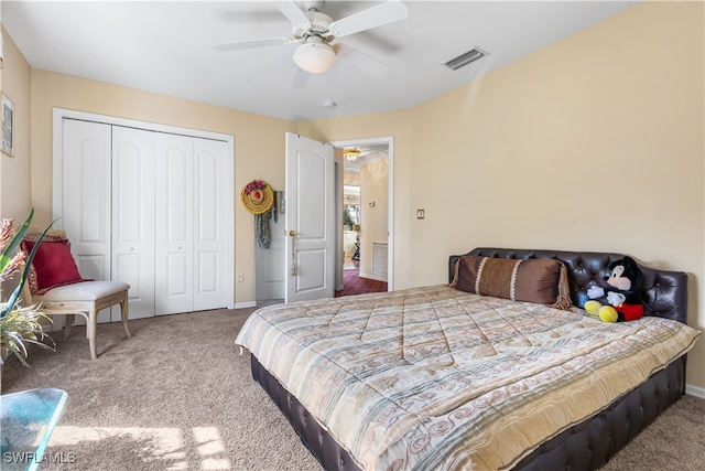 bedroom featuring ceiling fan, a closet, and carpet