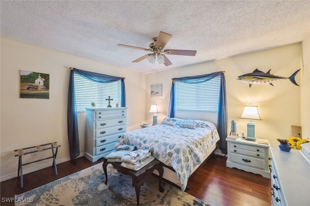 bedroom featuring a textured ceiling, ceiling fan, and dark wood-type flooring