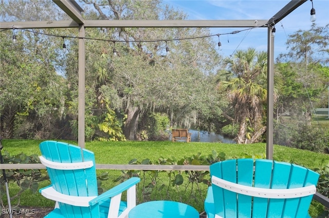 unfurnished sunroom with a water view